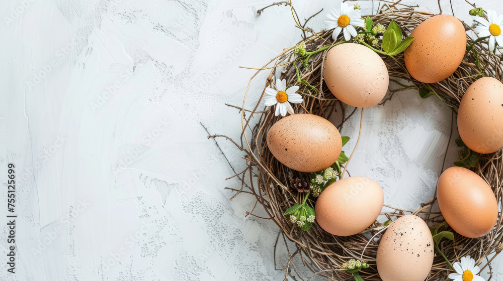 Easter background in rustic style. Festive wreath with eggs and daisies on white textured surface. Easter background in rustic style. Festive wreath with eggs and daisies on white textured surface.