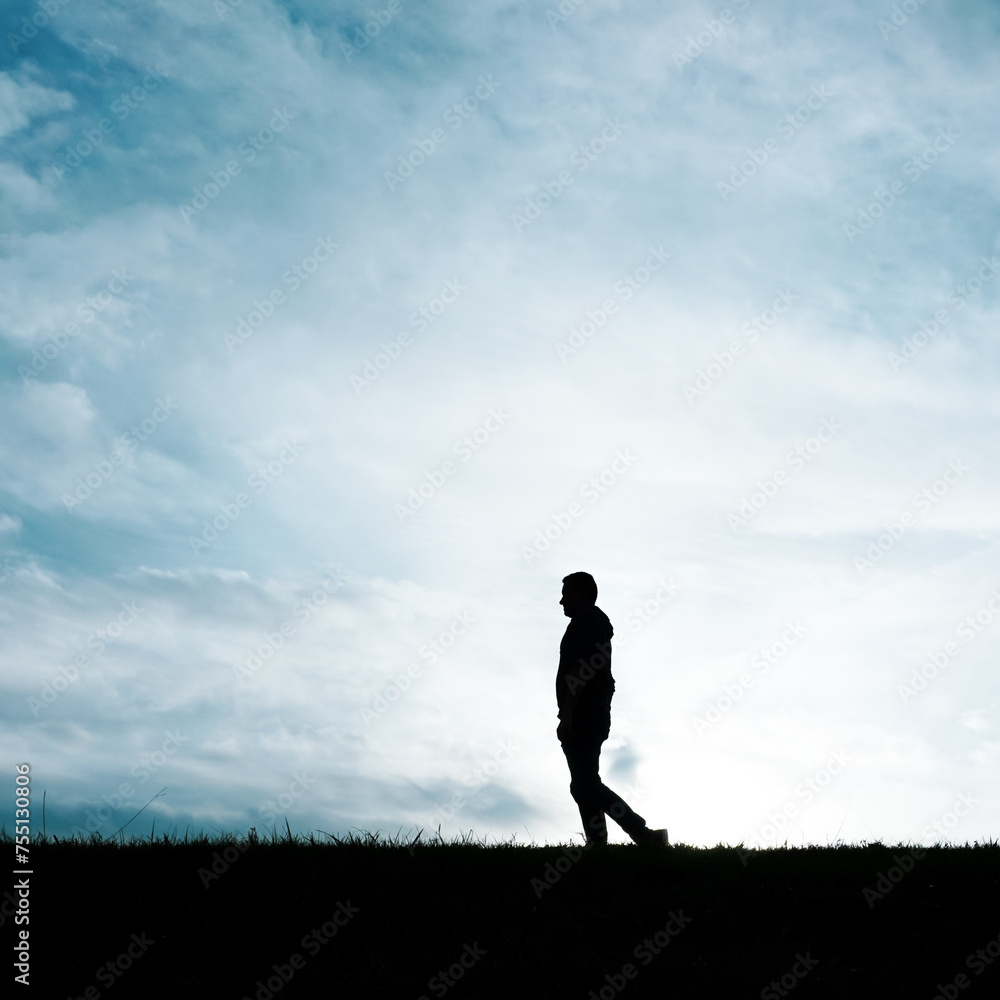 man silhouette in the countryside in the summer and sunset background 