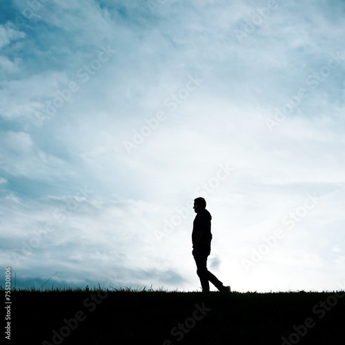 man silhouette in the countryside in the summer and sunset background  © Ismael