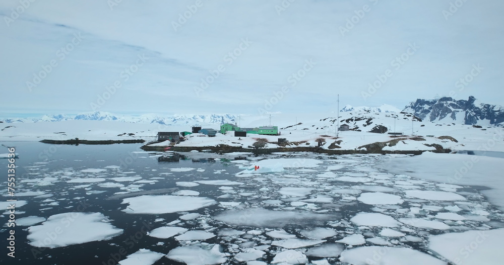 Antarctica polar science station, people explore ice movement, weather, and environmental conditions of global climate change. Scientific research wildlife, expedition to South Pole. Aerial drone shot Antarctica polar science station, people explore ice movement, weather, and environmental conditions of global climate change. Scientific research wildlife, expedition to South Pole. Aerial drone shot