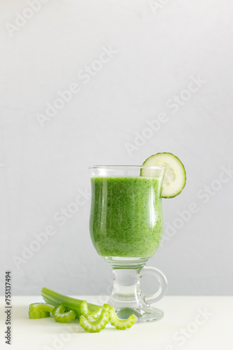 Green vegetable smoothie with fresh vegetables