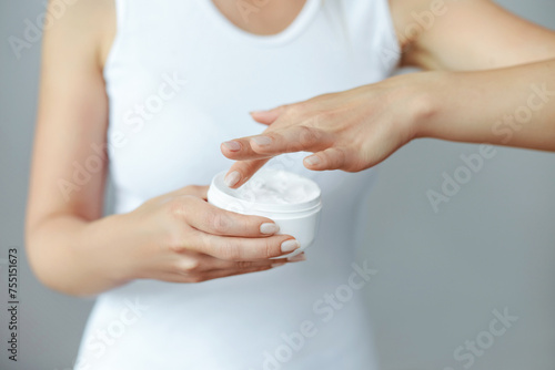 Hand Skin Care. Close Up Of Female Hands Holding Cream Tube, Woman Hands With Natural Manicure Nails Applying Cosmetic Hand Cream On Soft Silky Healthy Skin. B