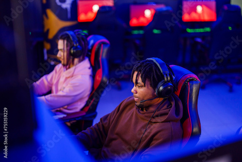 African american man gamer concentrating while playing online video game
