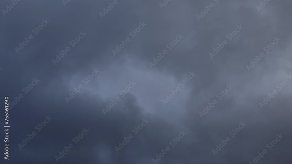 Light appears in the dark gray covered sky Light appears in the dark gray covered sky