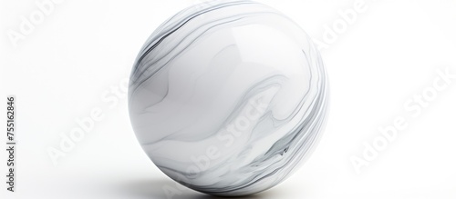 A white marble paperweight shaped like an egg rests on a sleek white surface, embodying elegance and simplicity in monochrome photography photo