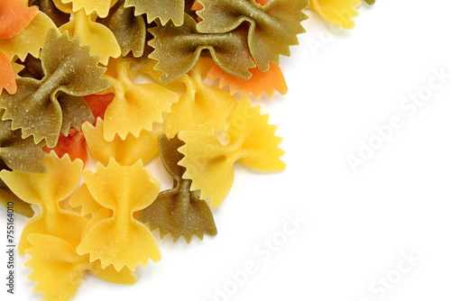 Color pasta in the form of bows. Raw farfalle with spinach and tomato isolated on a white background. High quality photo