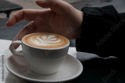 cup of coffee with hand