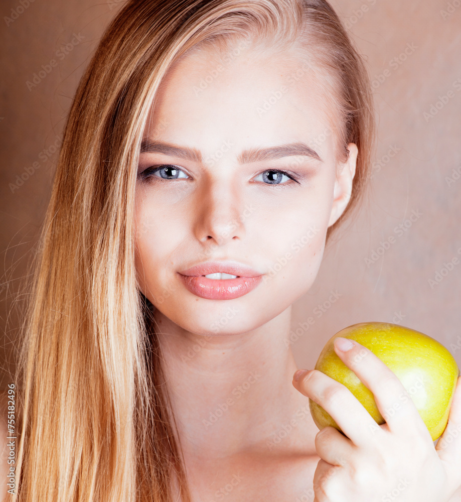 young pretty blond woman holding green apple smiling slim, lifestyle people concept young pretty blond woman holding green apple smiling slim, lifestyle people concept