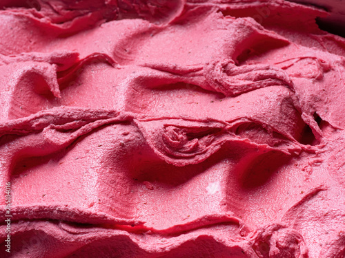 Frozen Strawberry flavour gelato - full frame detail. Close up of a pink surface texture of Ice cream.