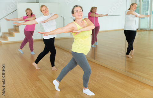 Aged European women are dancing during a fitness training session