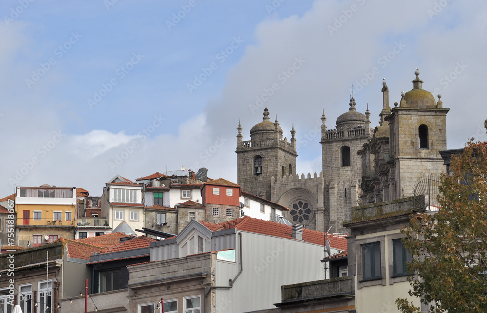 View of a part of the city of Porto in Portugal, several buildings that make up the slope of the hill of the Douro river valley, towers of the city's Cathedral