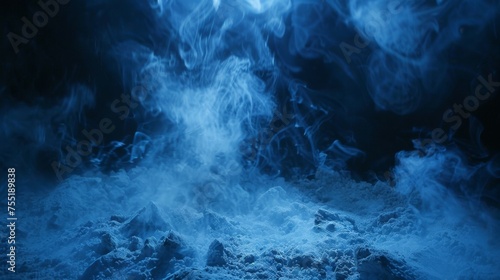 Thin, icy blue smoke strands against a frozen, dark backdrop, lit from below by cool ground lighting.