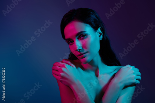 Photo of woman embrace herself look in camera isolated neon dark violet color background