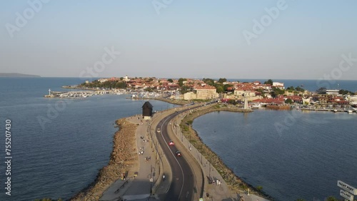 Bridge to Old Town of Nessebar, windmill and lanterns, road, landscape  Beautiful historical town Nessebar in Bulgaria. Drone view photo