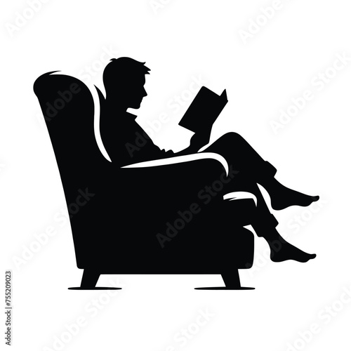 Silhouette of a Person Reading in a Cozy Armchair