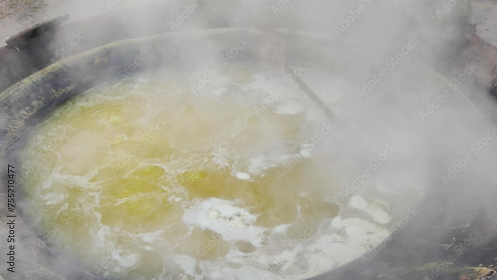 Sugarcane Juice Simmering in Traditional Oven Sugarcane Juice Simmering in Traditional Oven