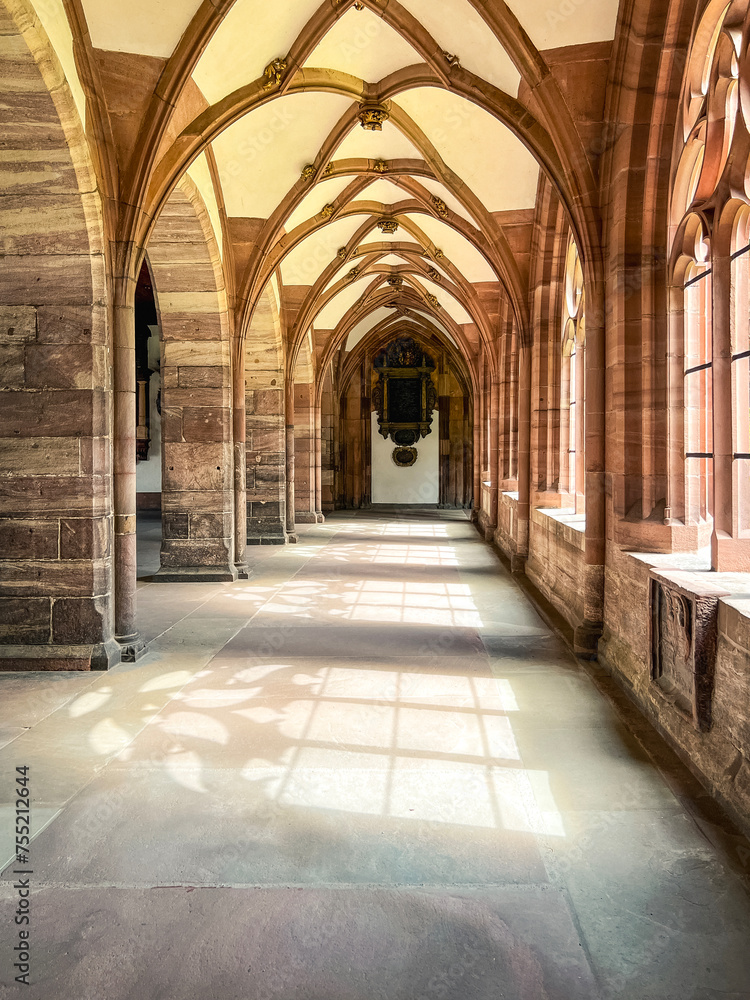 Ancient Stone Cathedral Courtyard Views. Basler Münster (Basel Minster) Cathedral in Basel, Switzerland. Built between the years 1019 and 1500 in the Romantic and Gothic styles. Ancient Stone Cathedral Courtyard Views. Basler Münster (Basel Minster) Cathedral in Basel, Switzerland. Built between the years 1019 and 1500 in the Romantic and Gothic styles.