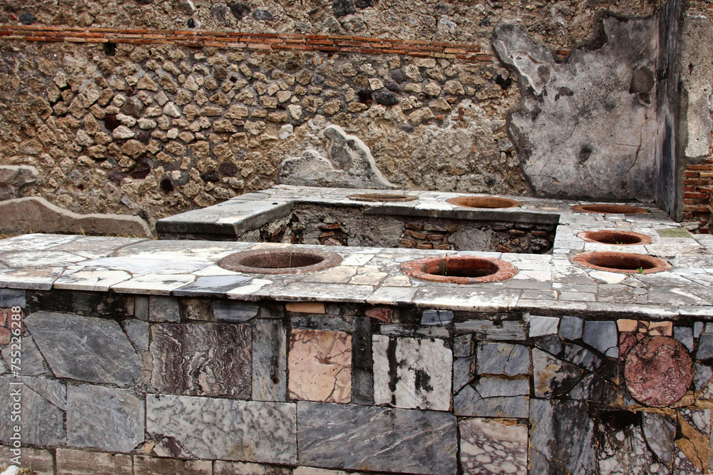 The thermopolium was the place where hot drinks and food were served, stored in large jars, built into the brick serving counter. The thermopolium was the place where hot drinks and food were served, stored in large jars, built into the brick serving counter.