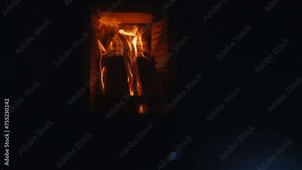 Nighttime ambiance: Modern fireplace casting a warm glow Nighttime ambiance: Modern fireplace casting a warm glow