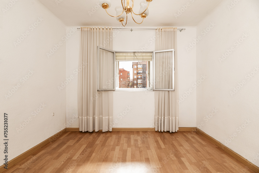 Fototapeta premium An empty room with light wooden floors with an open aluminum window and long dirty white curtains