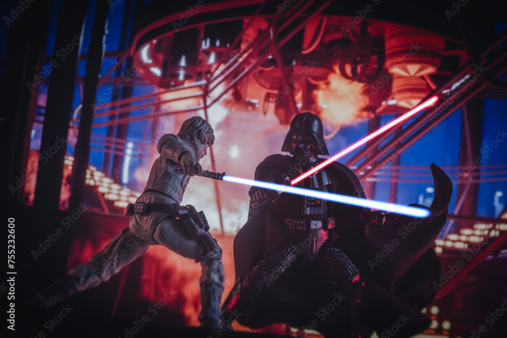 Naklejka premium NEW YORK USA, MAR 10 2024: recreation of a scene from Star Wars The Empire Strikes Back with Jedi Luke Skywalker battling Sith lord Darth Vader in the carbonite freezing chamber on Bespin - Hasbro