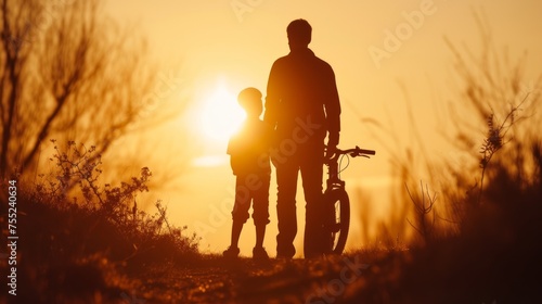 Heartwarming sunset silhouette father, son, and bicycle side by side