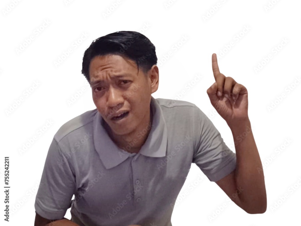 Wow and shock face of young Asian man in gray t-shirt with hands pointing up empty space. Wow and shock face of young Asian man in gray t-shirt with hands pointing up empty space.