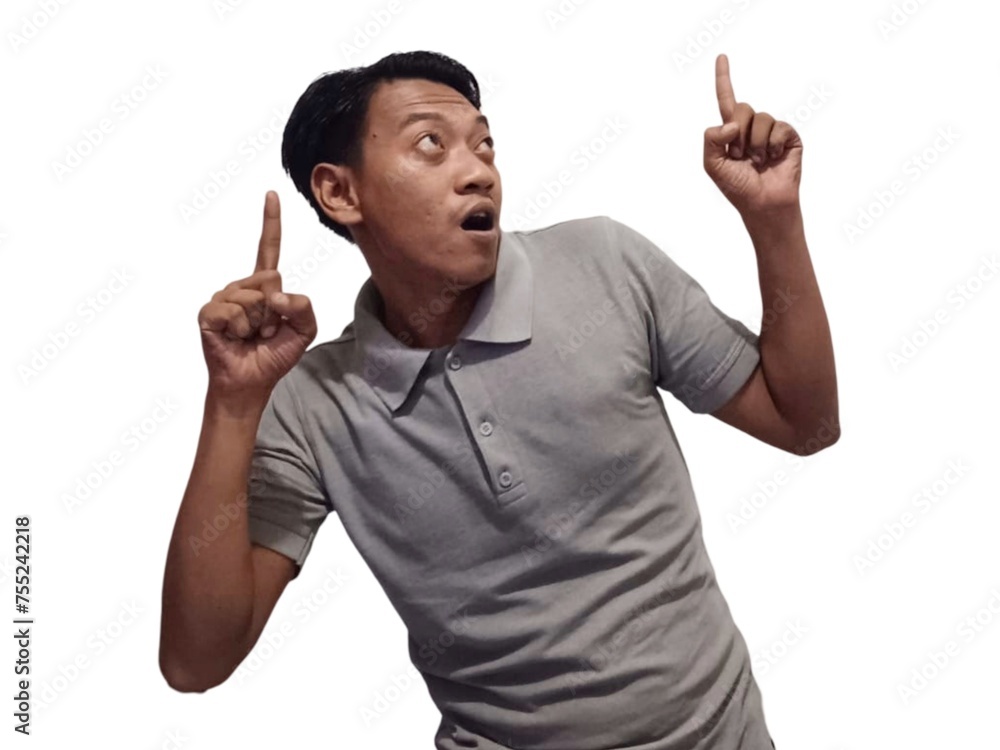 Wow and shock face of young Asian man in gray t-shirt with hands pointing up empty space. Wow and shock face of young Asian man in gray t-shirt with hands pointing up empty space.