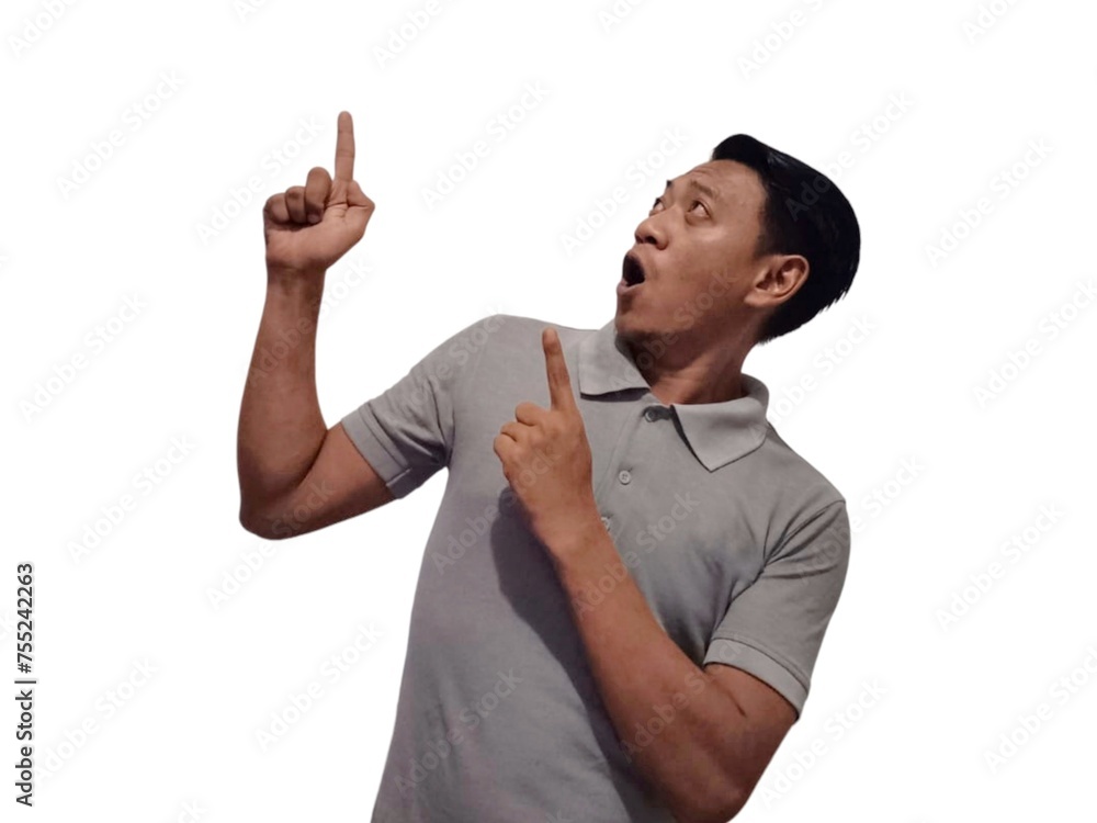 Wow and shock face of young Asian man in gray t-shirt with hands pointing up empty space. Wow and shock face of young Asian man in gray t-shirt with hands pointing up empty space.