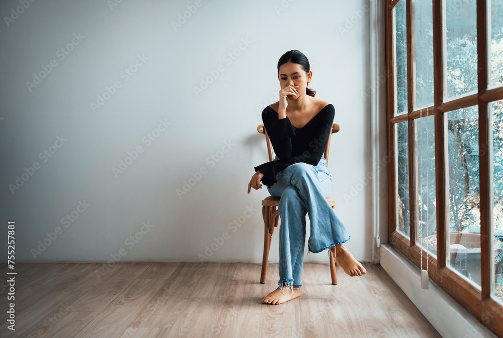 Depressed young Asian woman with mental health problem in mind need uttermost treatment from overthinking fatigue, disruptive thought, dissocial, anxiety and other mental health disorders . - obrazy, fototapety, plakaty 