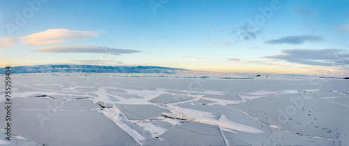 Panoramic view of frozen lake Baikal in winter, Russia.