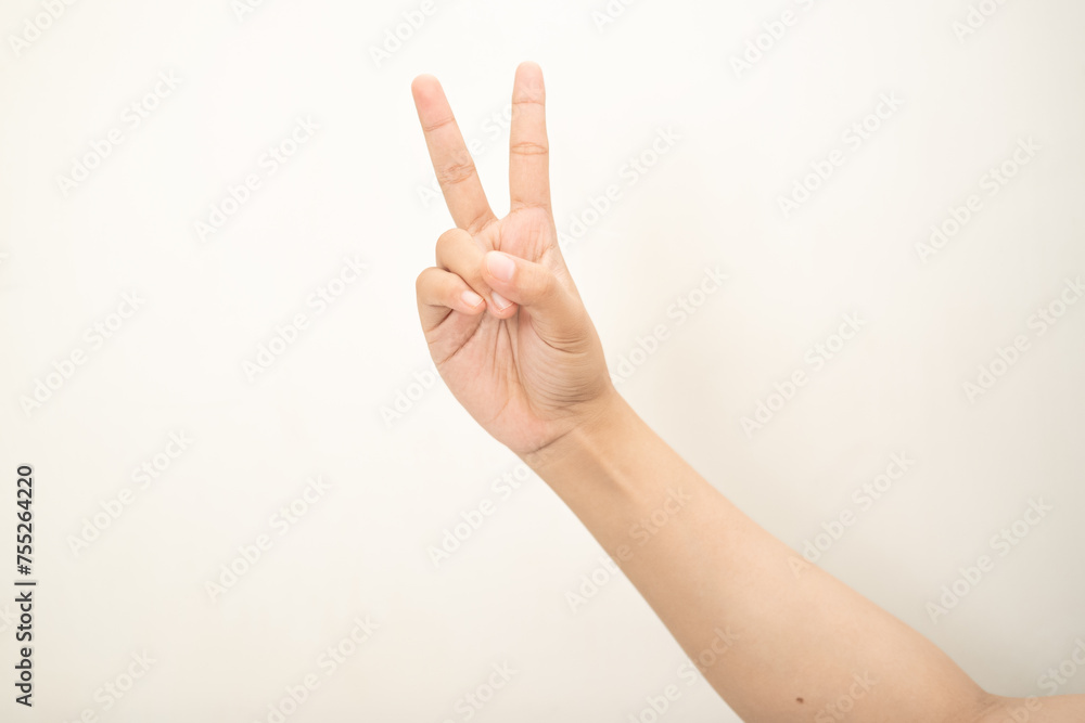 Fototapeta premium Hand pointing at something and make a sign on white background