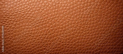 A detailed close-up view of a brown leather texture, showcasing the intricate patterns and quality of the material. This texture serves as a perfect background for interior design projects.