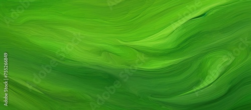 A close up of a green background with a swirling pattern of liquid green paint resembling grass and terrestrial plant, with tints of magenta and electric blue