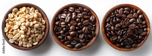 Four wooden bowls lined up with a selection of roasted coffee beans isolated on a white background.