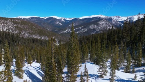 Boreas Mountain Pass Breckenridge Colorado aerial drone cinematic backcountry sunny blue clear sky North Fork Tiger Road Bald Rocky Mountains National Forest winter fresh snow snowmobile upward motion photo