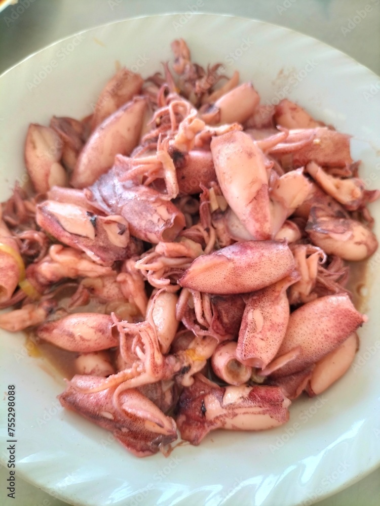 Delicious oyster sauce squid, restaurant-style home cooking. Indonesian seafood. Close-up.
Delicious oyster sauce squid, restaurant-style home cooking. Indonesian seafood. Close-up.