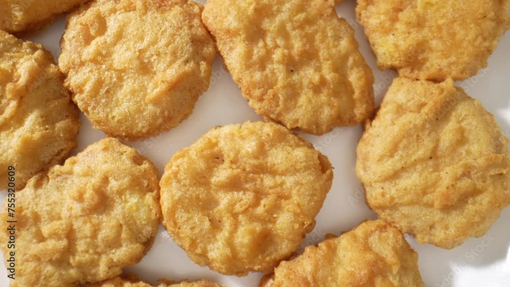 A chicken nugget is a small piece of chicken, breaded or battered, then deep-fried or baked. Popular as a fast food snack or a kid's menu item. Food concept. Fast-food background. 4K HDR.
A chicken nugget is a small piece of chicken, breaded or battered, then deep-fried or baked. Popular as a fast food snack or a kid's menu item. Food concept. Fast-food background. 4K HDR.