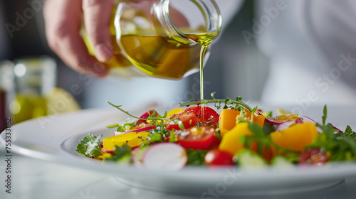 Chef Dressing Fresh Salad with Olive Oil
