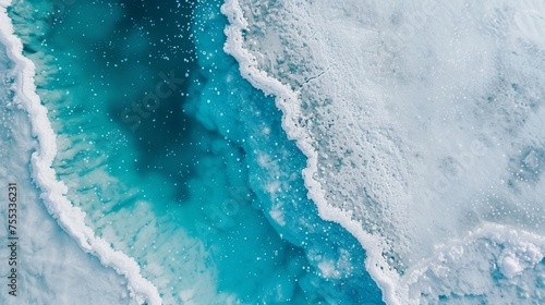 The contrast between the bright blue seawater and the stark white salt creating a striking visual display.