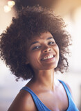 Woman, portrait and happiness in fashion with bokeh, natural beauty and casual outfit in summer. African person, face and smile with afro hairstyle, wellness or trendy style with lens flare in Africa