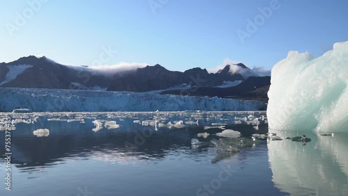 Time Lapse, Glacier Lagoon and Flowing Pieces of Ice Under Glacier, 14th of July, Svalbard, Norway photo