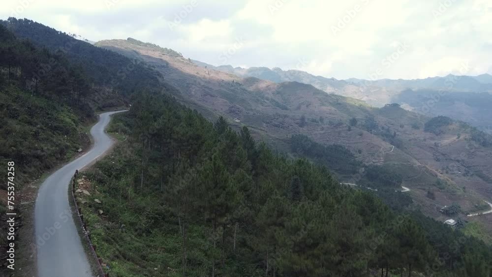 Flying over mountain range forest in Vietnam Flying over mountain range forest in Vietnam