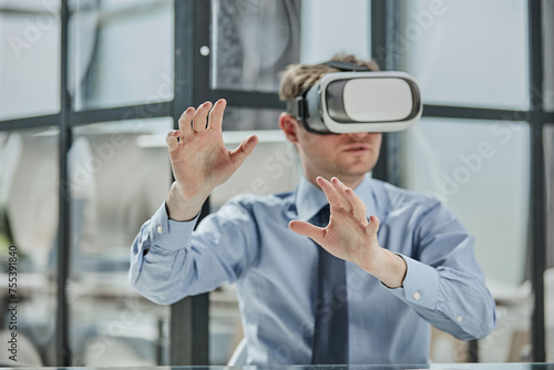 businessman in virtual reality headset in the office © Katsiaryna