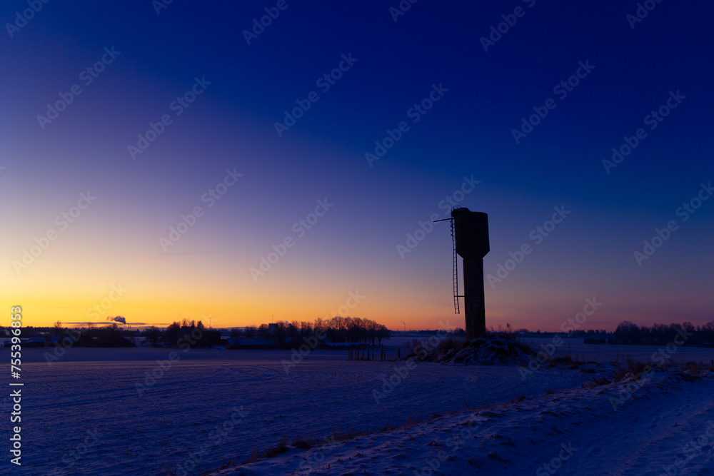 A beautiful morning scenery of an industrial construction against the sky. Early winter scenery of Northern Europe.