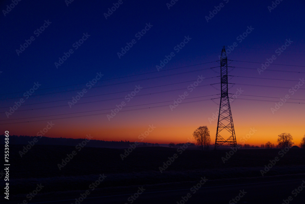 Fototapeta premium A beautiful morning scenery of an industrial construction against the sky. Early winter scenery of Northern Europe.