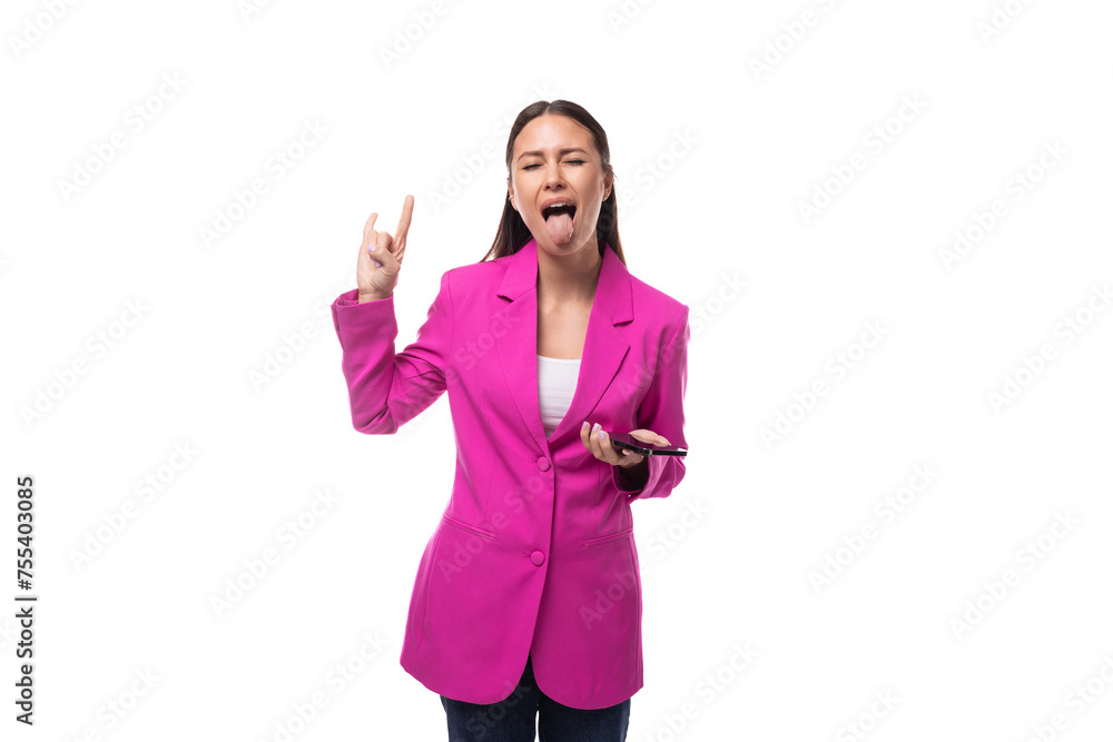 young slender office worker woman with black hair dressed in a lilac jacket communicates using a smartphone young slender office worker woman with black hair dressed in a lilac jacket communicates using a smartphone