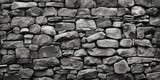 A black and white photo of a stone wall, perfect for architectural backgrounds