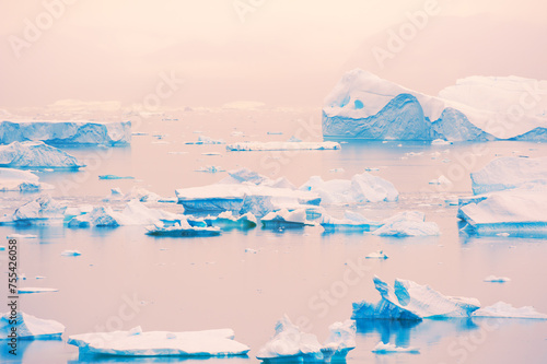 Icebergs at sunset in Greenland. Atlantic ocean, Ilulissat icefjord, Greenland.