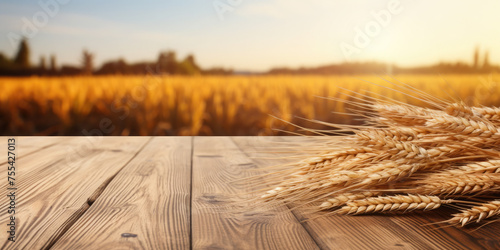 Empty wooden table for product demonstration and presentation on the background of a wheat field. Banner